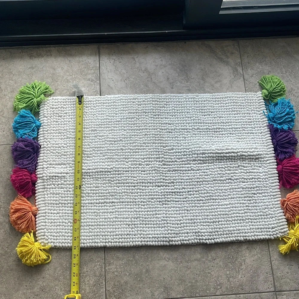 Pom Pom floor mat. NWOT. Never used. Non smoker home.